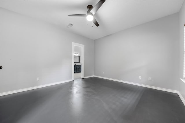17520 E Williams Rd, Conroe, TX 77303 - unfurnished room with ceiling fan, concrete flooring, and baseboards