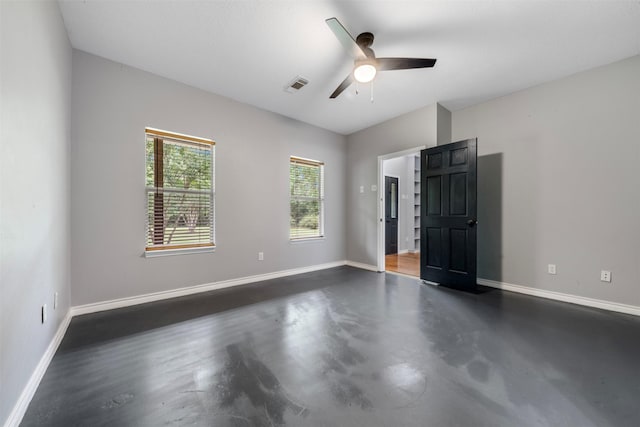 17520 E Williams Rd, Conroe, TX 77303 - unfurnished bedroom featuring baseboards, ceiling fan, and finished concrete flooring