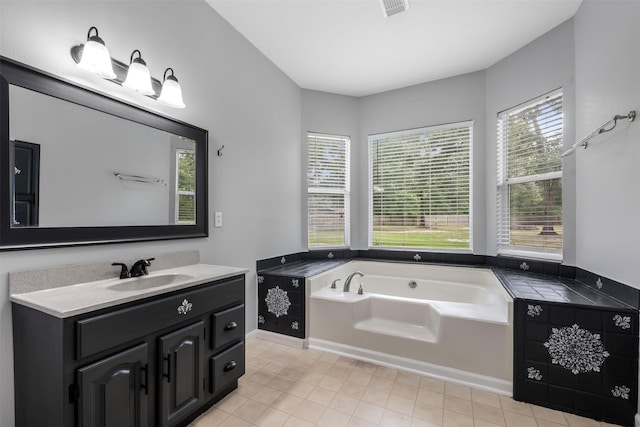 17520 E Williams Rd, Conroe, TX 77303 - bathroom with vanity, a bath, and tile patterned flooring