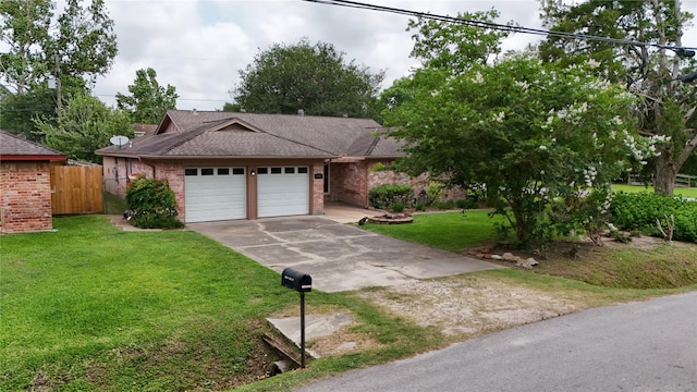 11902 25th St, Santa Fe, TX 77510 - view of front facade featuring concrete driveway, brick siding, a garage, and roof with shingles