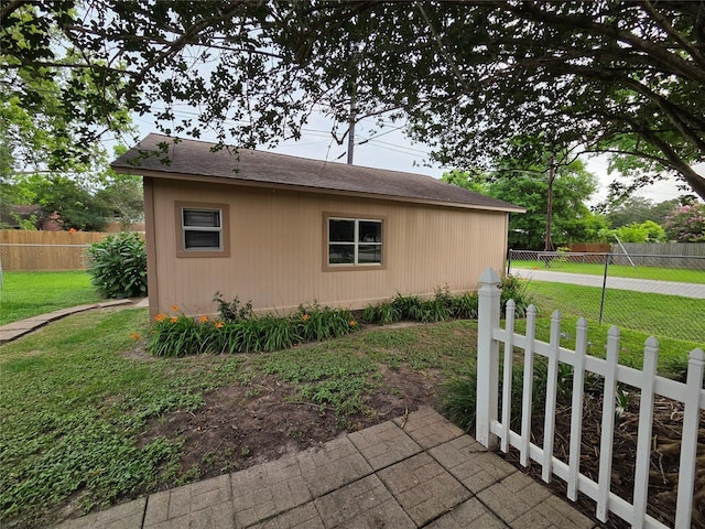 11902 25th St, Santa Fe, TX 77510 - view of side of home featuring roof with shingles