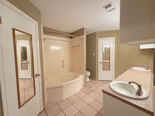 11902 25th St, Santa Fe, TX 77510 - bathroom featuring shower / bath combination, tile patterned flooring, double vanity, toilet, and a textured ceiling