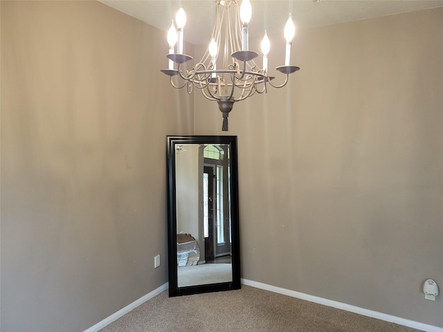 5647 Horseshoe Fls, Missouri City, TX 77459 - empty room featuring a chandelier, carpet flooring, and baseboards