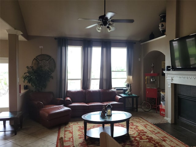5647 Horseshoe Fls, Missouri City, TX 77459 - living area featuring light tile patterned flooring, a ceiling fan, healthy amount of natural light, and a tiled fireplace