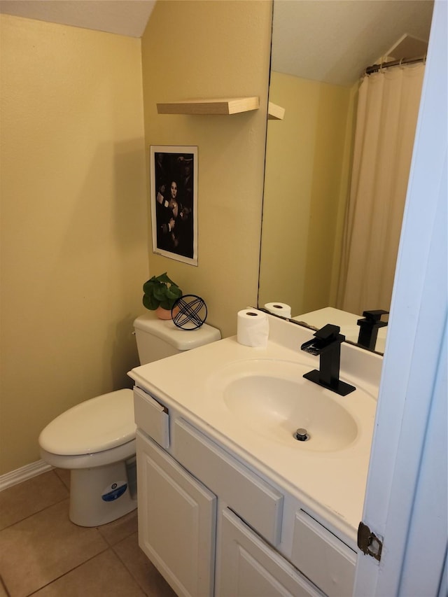 5647 Horseshoe Fls, Missouri City, TX 77459 - full bathroom with toilet, vanity, tile patterned floors, baseboards, and lofted ceiling
