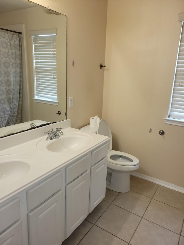 5647 Horseshoe Fls, Missouri City, TX 77459 - bathroom with tile patterned floors, double vanity, and toilet