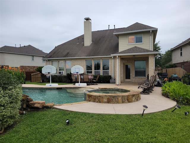 5647 Horseshoe Fls, Missouri City, TX 77459 - rear view of house with a patio, brick siding, and a chimney