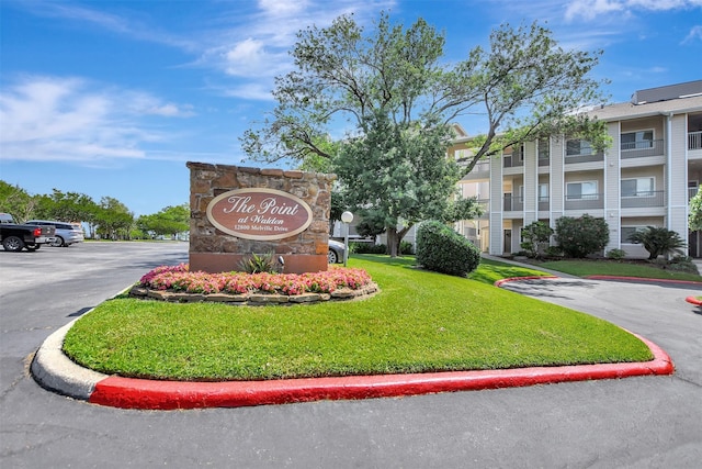 12800 Melville Dr Unit B302, Montgomery, TX 77356 - community / neighborhood sign with uncovered parking and a lawn