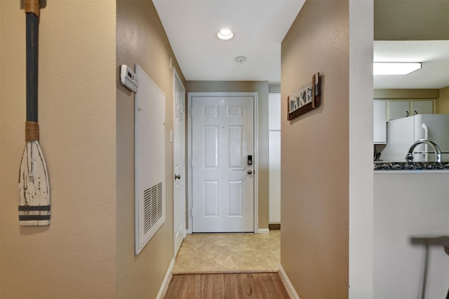 12800 Melville Dr Unit B302, Montgomery, TX 77356 - hallway with light wood-style flooring and baseboards