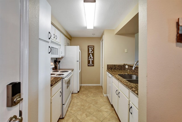 12800 Melville Dr Unit B302, Montgomery, TX 77356 - kitchen featuring white appliances, a sink, white cabinets, and light tile patterned floors