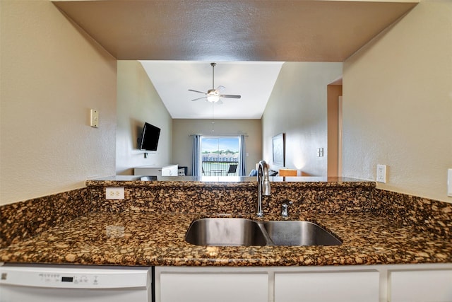 12800 Melville Dr Unit B302, Montgomery, TX 77356 - kitchen with dishwasher, a sink, ceiling fan, white cabinets, and dark stone countertops