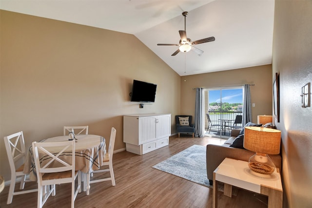 12800 Melville Dr Unit B302, Montgomery, TX 77356 - living area with a ceiling fan, wood finished floors, baseboards, and high vaulted ceiling