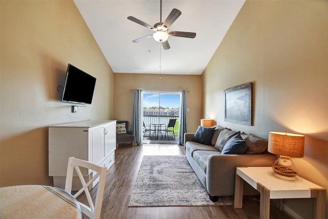 12800 Melville Dr Unit B302, Montgomery, TX 77356 - living area featuring vaulted ceiling, ceiling fan, and wood finished floors