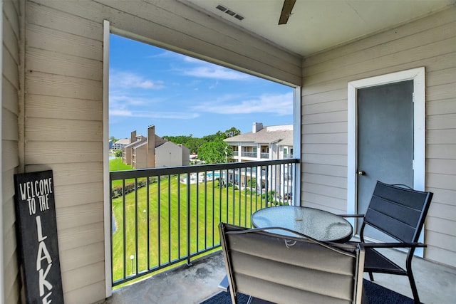 12800 Melville Dr Unit B302, Montgomery, TX 77356 - balcony with ceiling fan, a residential view, and outdoor dining space