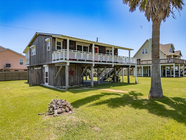 16519 Captain Kidd Rd, Jamaica Beach, TX 77554 - rear view of house featuring stairway, a deck, and board and batten siding