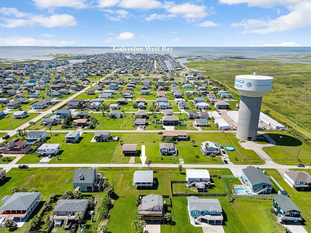 16519 Captain Kidd Rd, Jamaica Beach, TX 77554 - aerial view of residential area with a large body of water