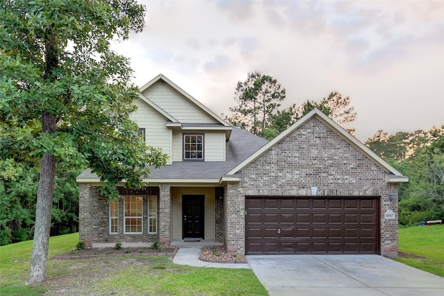 10567 Sunflower Dr, Conroe, TX 77318 - view of front of property featuring brick siding, an attached garage, and a front lawn