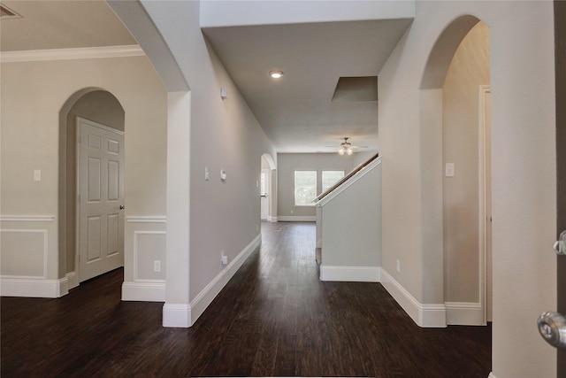 10567 Sunflower Dr, Conroe, TX 77318 - corridor featuring wood finished floors, arched walkways, baseboards, ornamental molding, and stairs
