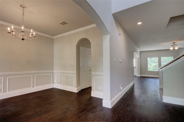 10567 Sunflower Dr, Conroe, TX 77318 - unfurnished dining area featuring dark wood finished floors, a ceiling fan, ornamental molding, arched walkways, and a chandelier