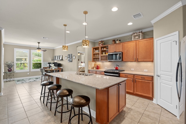231 Ranch House Ln, Richmond, TX 77469 - kitchen with appliances with stainless steel finishes, light tile patterned flooring, decorative backsplash, ornamental molding, and light stone counters