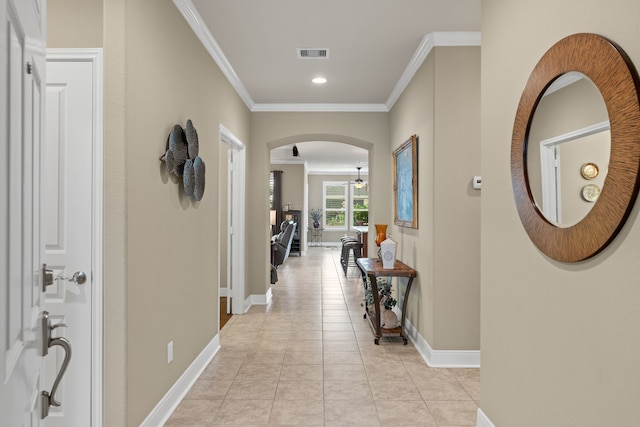 231 Ranch House Ln, Richmond, TX 77469 - hall with ornamental molding, light tile patterned floors, arched walkways, and recessed lighting