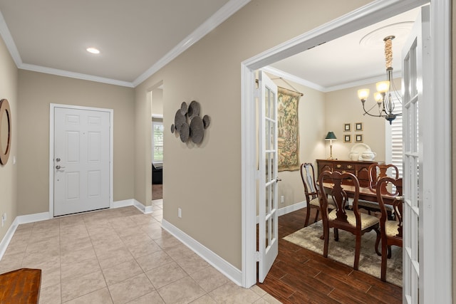 231 Ranch House Ln, Richmond, TX 77469 - foyer with a chandelier, ornamental molding, wood finished floors, and recessed lighting