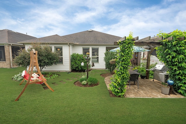 231 Ranch House Ln, Richmond, TX 77469 - back of house featuring a patio, a lawn, and roof with shingles