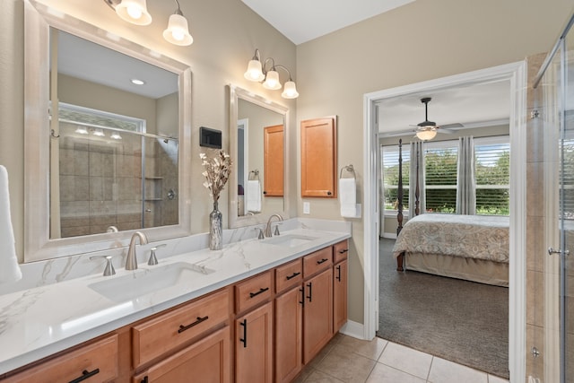 231 Ranch House Ln, Richmond, TX 77469 - full bath featuring double vanity, tile patterned floors, a shower stall, ensuite bath, and a ceiling fan