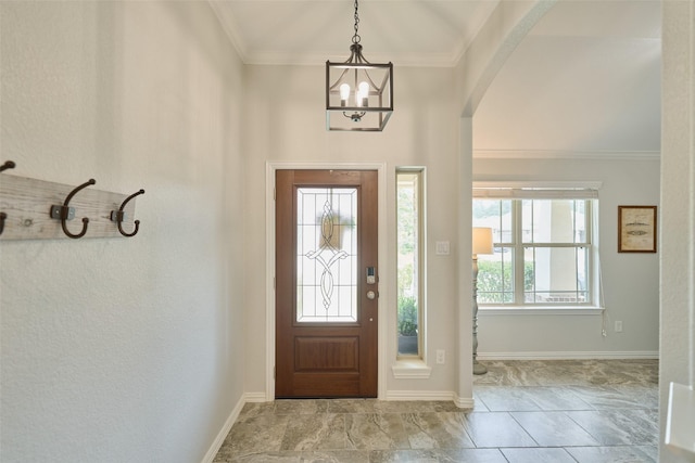 2947 Twin Cove Ct, Conroe, TX 77301 - foyer featuring arched walkways, crown molding, and a chandelier