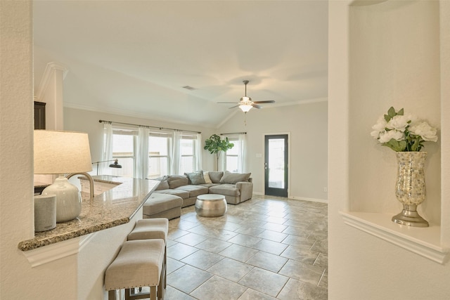 2947 Twin Cove Ct, Conroe, TX 77301 - living room featuring ceiling fan, vaulted ceiling, and ornamental molding