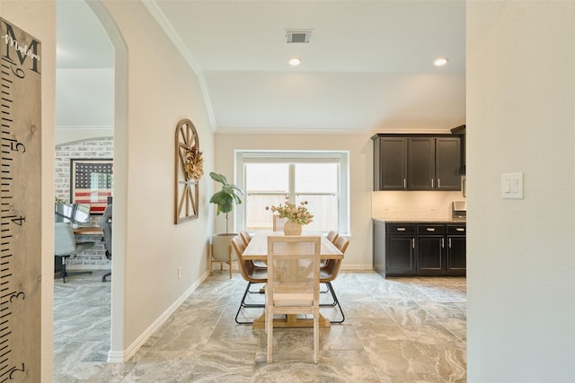 2947 Twin Cove Ct, Conroe, TX 77301 - dining room featuring ornamental molding and arched walkways