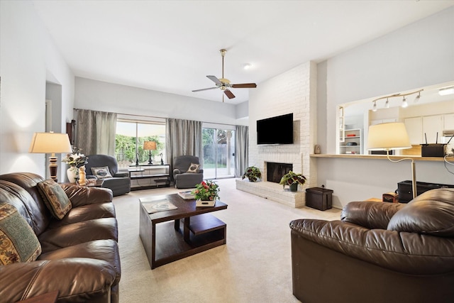 1939 Ash Meadow Dr, Houston, TX 77090 - living room featuring ceiling fan, carpet floors, and a fireplace