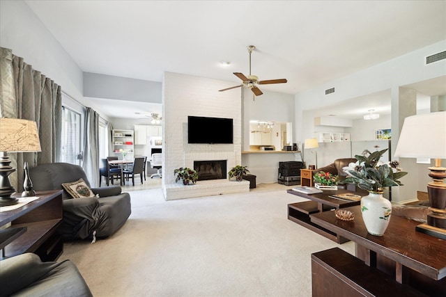1939 Ash Meadow Dr, Houston, TX 77090 - living room with a ceiling fan, carpet, and a brick fireplace