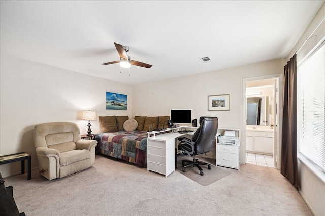 1939 Ash Meadow Dr, Houston, TX 77090 - bedroom featuring a desk, light colored carpet, a ceiling fan, and connected bathroom