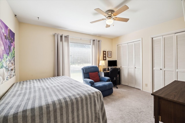 1939 Ash Meadow Dr, Houston, TX 77090 - carpeted bedroom featuring multiple closets, an office area, and a ceiling fan