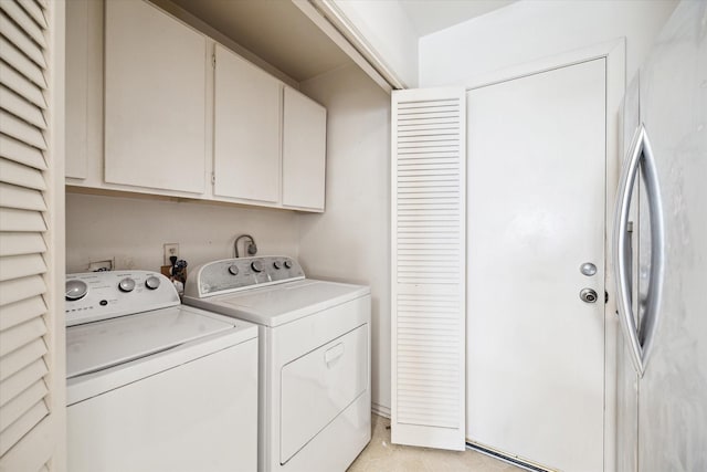 1939 Ash Meadow Dr, Houston, TX 77090 - laundry area featuring cabinet space and washing machine and clothes dryer