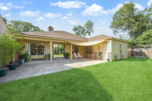 1939 Ash Meadow Dr, Houston, TX 77090 - rear view of house with a patio area and a chimney
