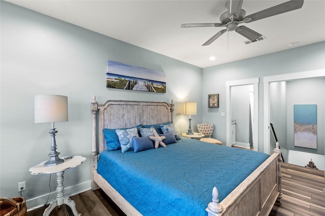 1317 Emerald Dr, Crystal Beach, TX 77650 - bedroom with dark wood-type flooring, baseboards, ceiling fan, and recessed lighting