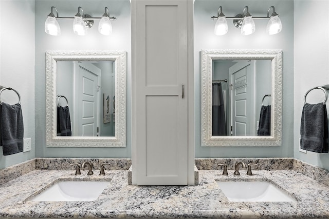 1317 Emerald Dr, Crystal Beach, TX 77650 - bathroom featuring double vanity