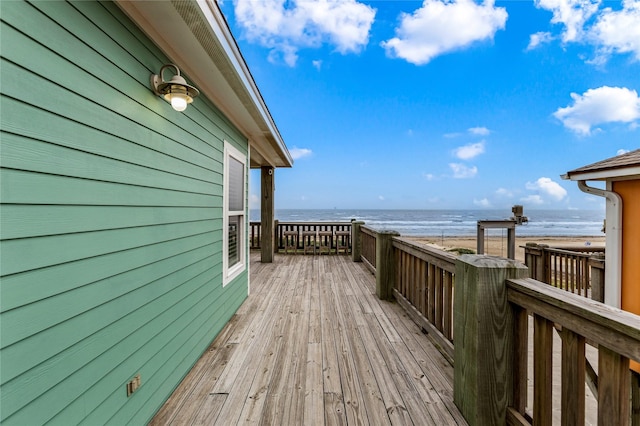 1317 Emerald Dr, Crystal Beach, TX 77650 - wooden deck featuring view of water and beach