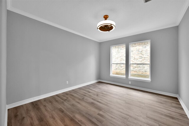 13646 Leafy Arbor Dr, Montgomery, TX 77356 - empty room with ornamental molding, baseboards, and wood finished floors