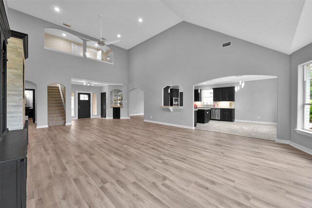 13646 Leafy Arbor Dr, Montgomery, TX 77356 - unfurnished living room with ceiling fan, light wood-type flooring, high vaulted ceiling, baseboards, and recessed lighting