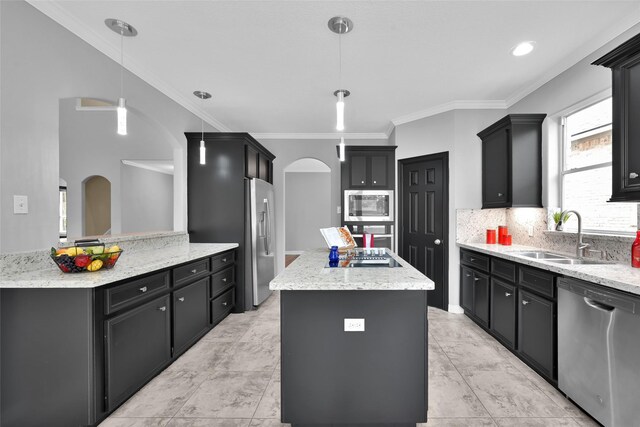13646 Leafy Arbor Dr, Montgomery, TX 77356 - kitchen with appliances with stainless steel finishes, a sink, a center island, arched walkways, and crown molding