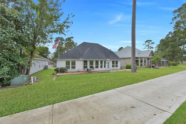 13646 Leafy Arbor Dr, Montgomery, TX 77356 - view of front facade featuring a front yard and brick siding