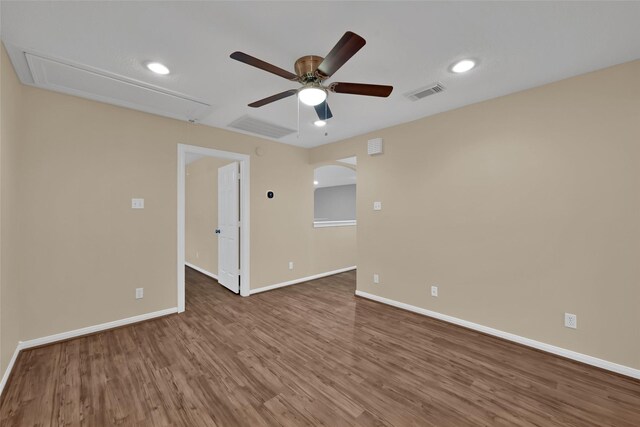 13646 Leafy Arbor Dr, Montgomery, TX 77356 - unfurnished room featuring a ceiling fan, wood finished floors, baseboards, arched walkways, and recessed lighting