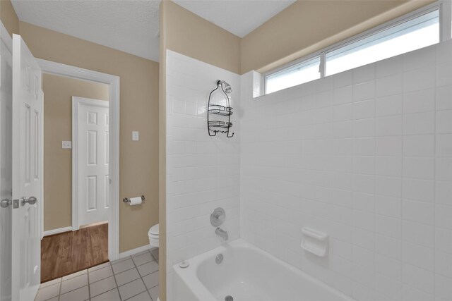 13646 Leafy Arbor Dr, Montgomery, TX 77356 - full bath with toilet, tile patterned floors,  shower combination, and baseboards