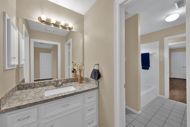 13646 Leafy Arbor Dr, Montgomery, TX 77356 - bathroom with vanity, tile patterned floors, and baseboards