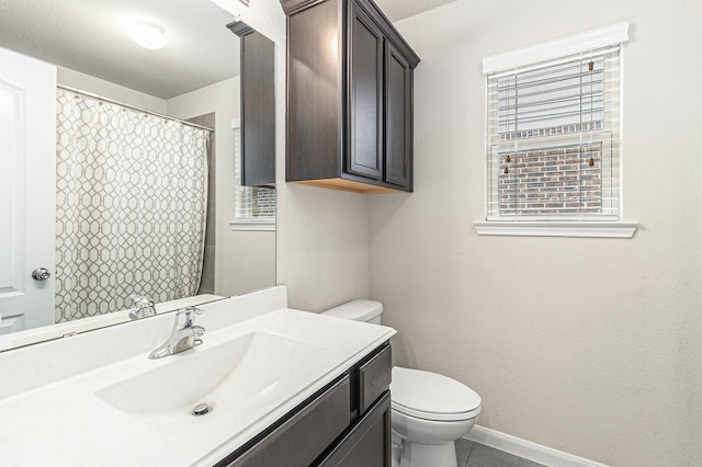 23722 Willow Haven Dr, Spring, TX 77389 - bathroom with toilet, vanity, and tile patterned flooring
