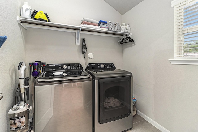 23722 Willow Haven Dr, Spring, TX 77389 - laundry area with washing machine and clothes dryer and baseboards