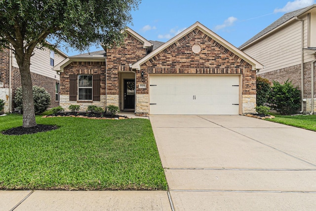 23722 Willow Haven Dr, Spring, TX 77389 - view of front of house featuring an attached garage, driveway, a front yard, and brick siding